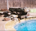 synergy custom pool natural stone diving rock